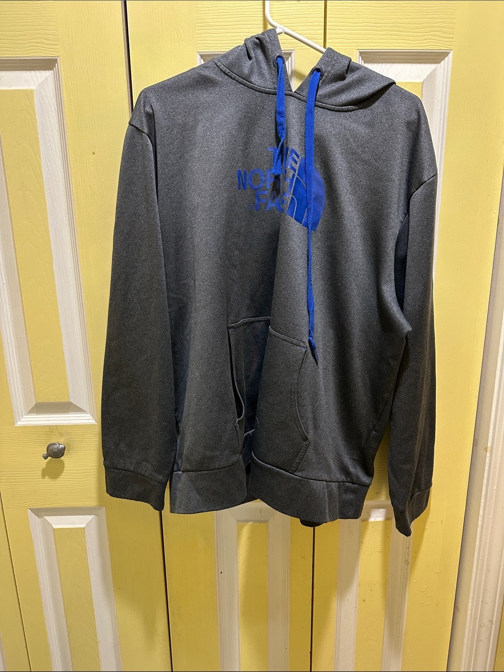 The North Face Men’s Charcoal Hoodie with Blue Logo